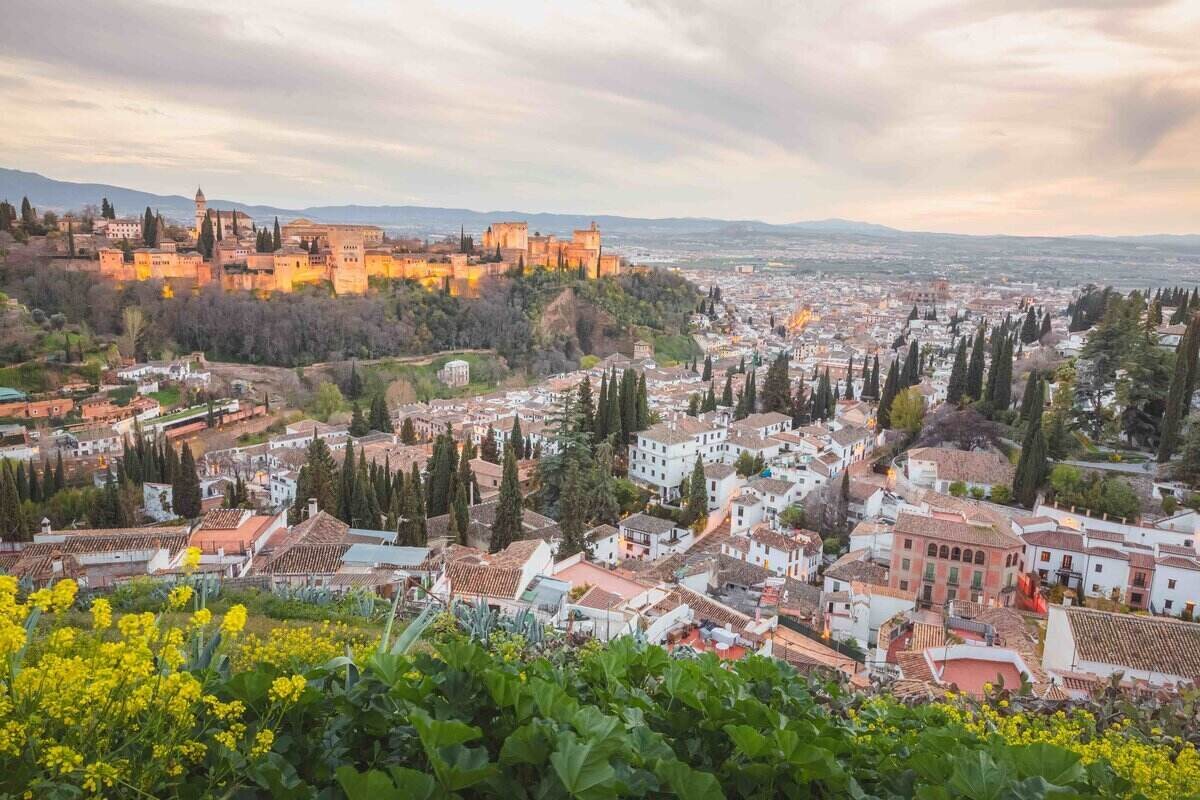 Evening cityscape view of the Alhambra and the historic Moorish or Arab Quarter (albaicin) in Granada, Andalusia, Spain.
